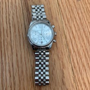 Michael Kors silver watch. Needs new battery. Wrist is about 7.5 inches